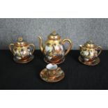 A 19th century Japanese Meiji satsuma coffee set, hand decorated with gilt highlights, character