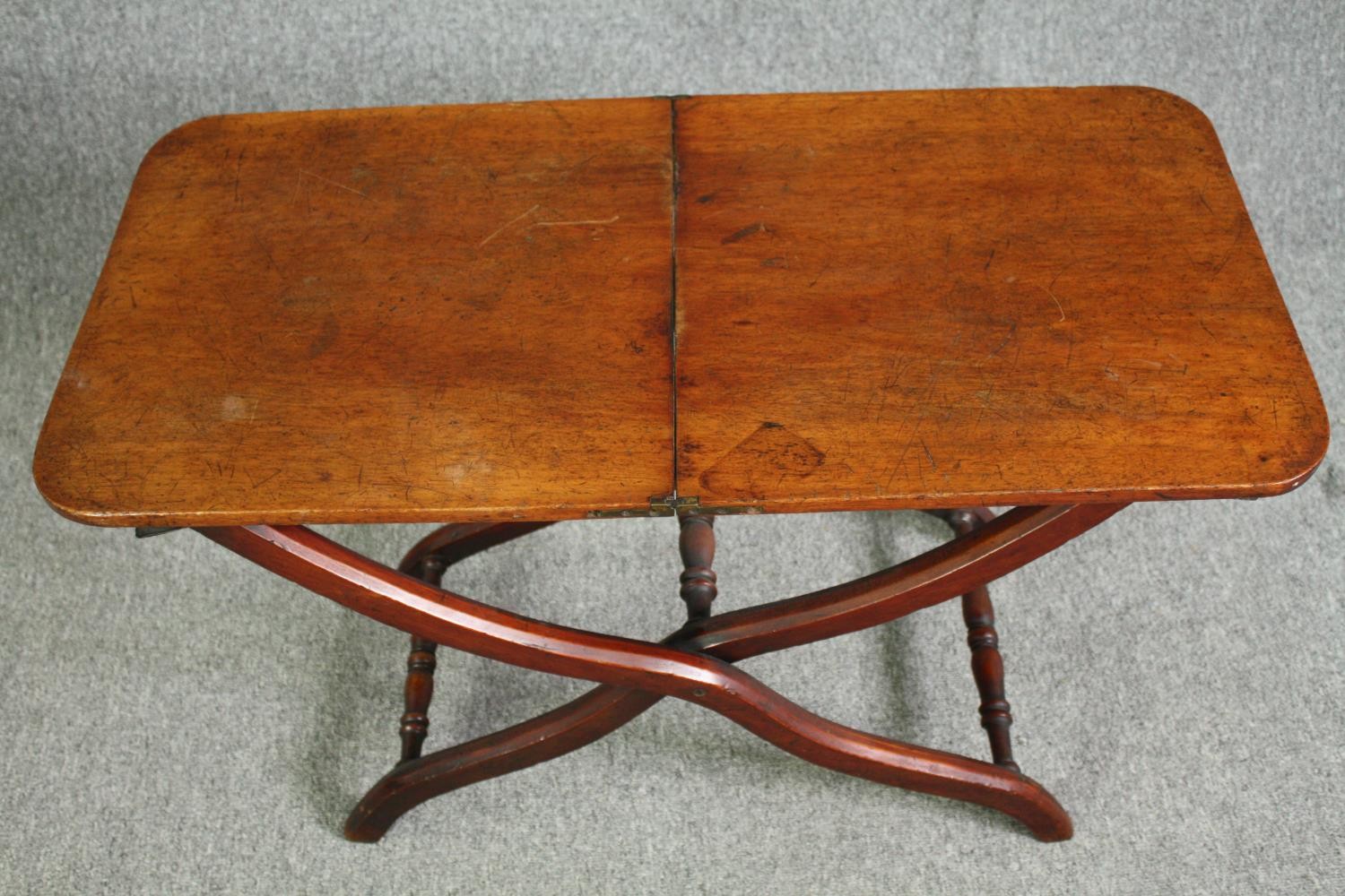 A 19th century mahogany folding campaign table, later adapted to a fixed top. H.59 W.91 W.45cm. - Image 5 of 7