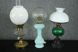 Two 19th century glass oil lamps, both wired for electricity. H.54cm. (largest).