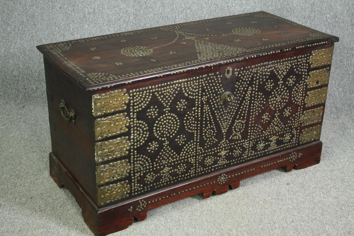 A 19th century Indian rosewood Zanzibar chest with allover studded ornament and fitted interior. H. - Image 2 of 7