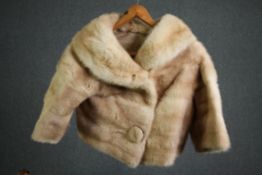 A bespoke made vintage reversible pale mink fur bolero jacket with hand embroidered silk interior.
