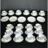 A set of twelve French blue and white tea cups and saucers and a set of six vintage Colclough tea