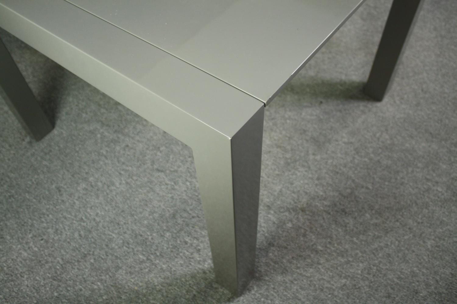 A contemporary extending dining table with integral leaf. H.76 W.170 (ext) D.103cm. - Image 6 of 10