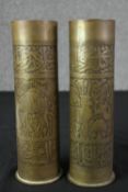 A pair of engraved brass shell cases. H.28cm. (each).