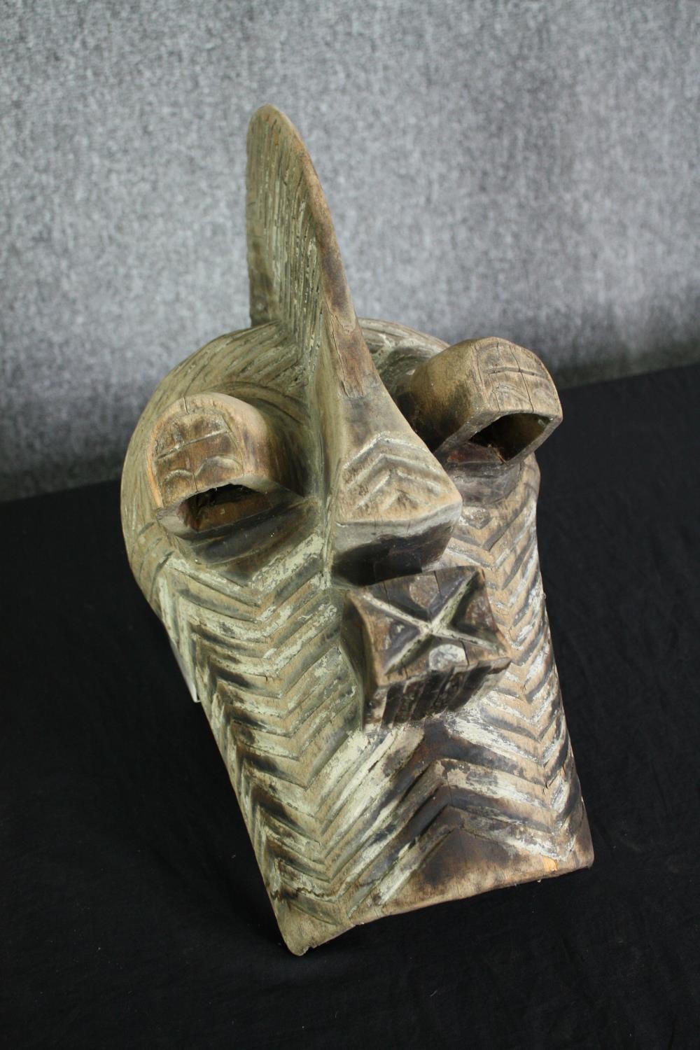 A Congolese Kifwebe Songye mask along with a painted tribal mask. H.55cm. (largest). - Image 7 of 10