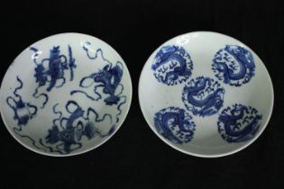 Two 19th century Chinese blue and white hand painted porcelain plates, one with five dragons in