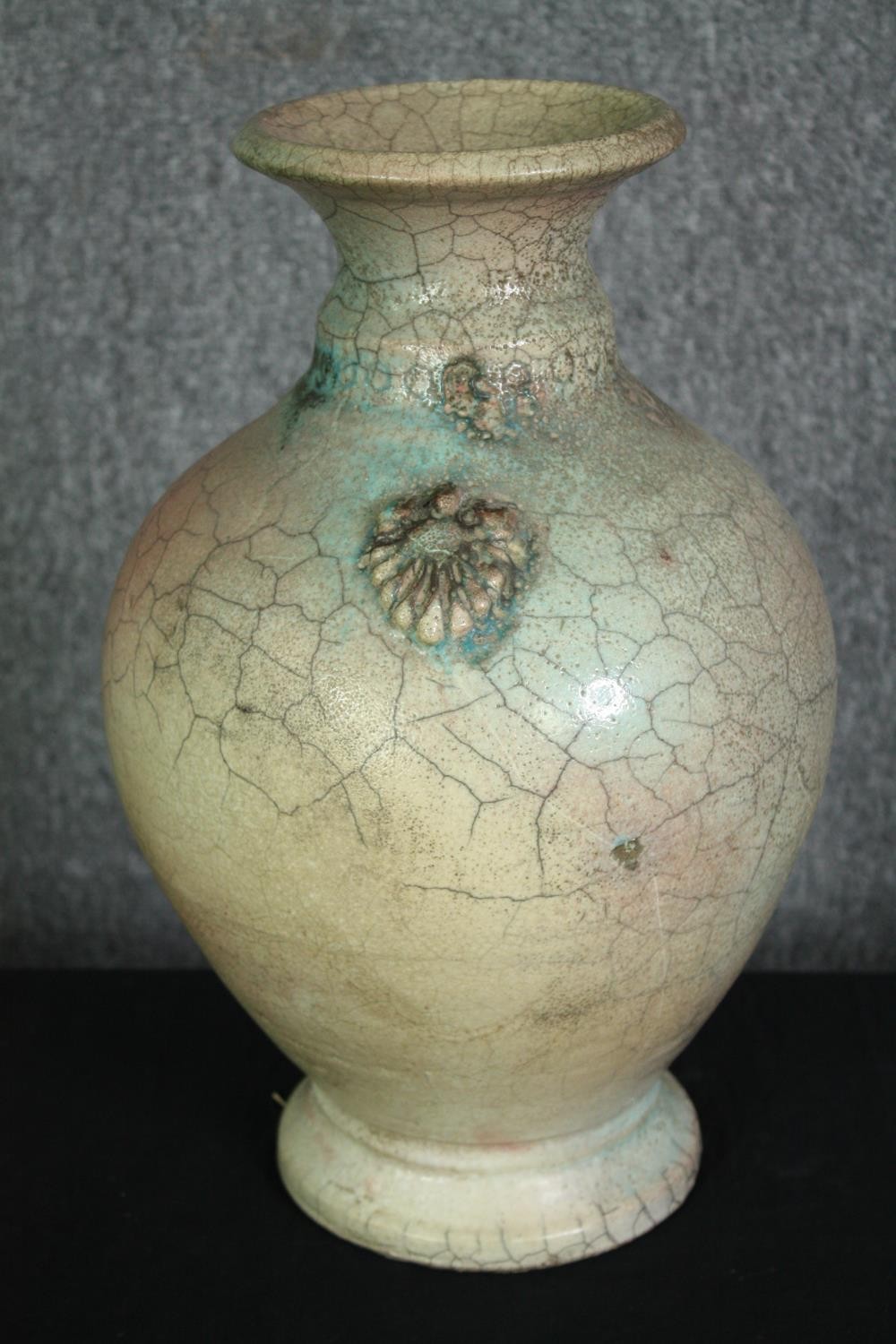 A large oriental peach and turquoise crackle glaze vase with signature to base, raised handles. H.