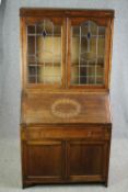 Bureau bookcase, mid century oak with leaded glass doors. H.183 W.91 D.43cm.