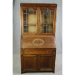 Bureau bookcase, mid century oak with leaded glass doors. H.183 W.91 D.43cm.