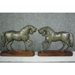 A pair of 19th century brass horse figures on wooden plinths. H.23cm. (each).