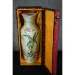 A boxed early 20th century Chinese hand painted Famille rose porcelain vase decorated with banana