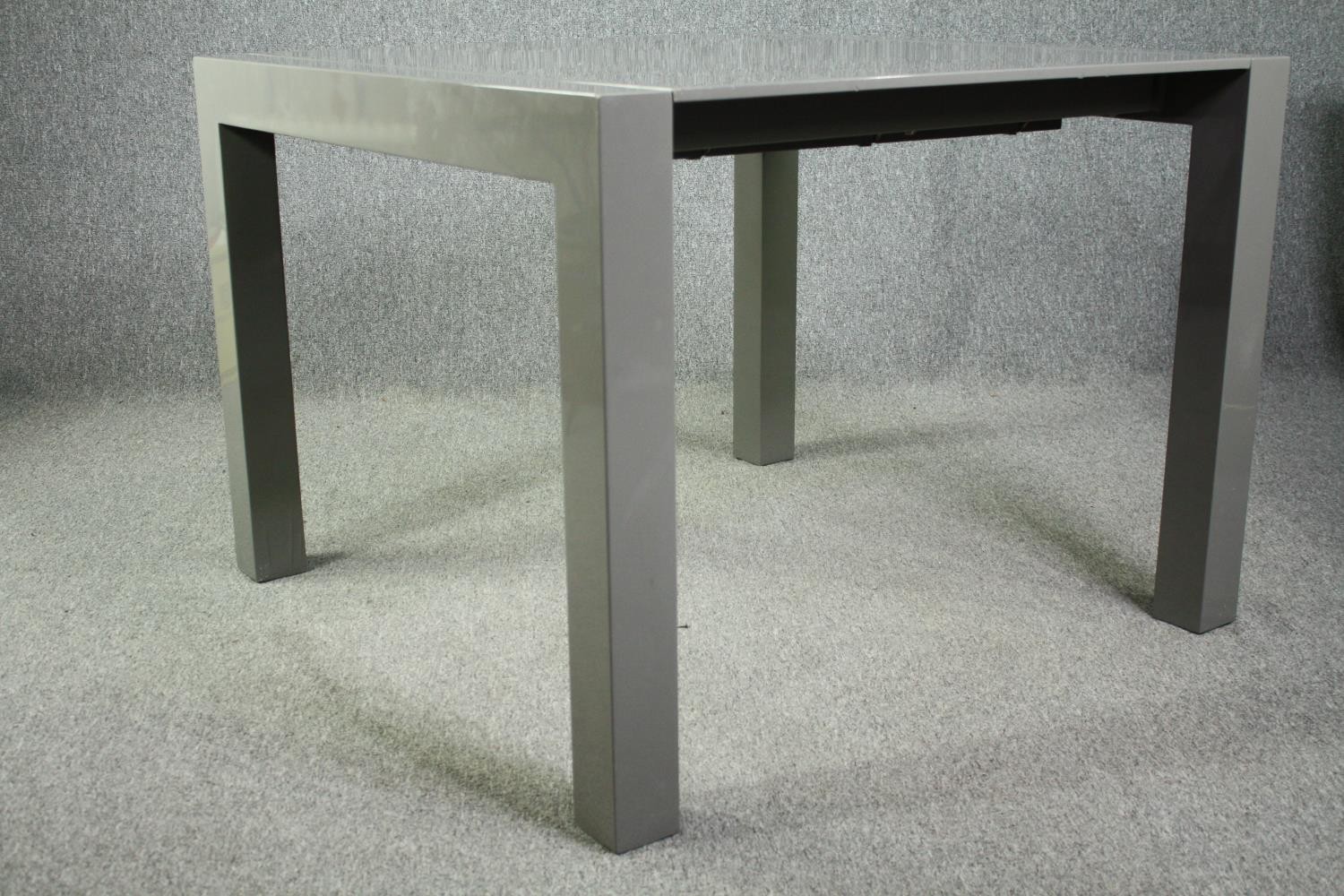 A contemporary extending dining table with integral leaf. H.76 W.170 (ext) D.103cm. - Image 4 of 10