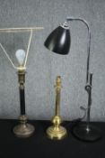 A mid century chrome adjustable desk lamp along with two brass table lamps. H.73cm. (largest)
