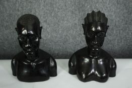 A pair of African carved ebony busts; male and female. H.23cm. (each).