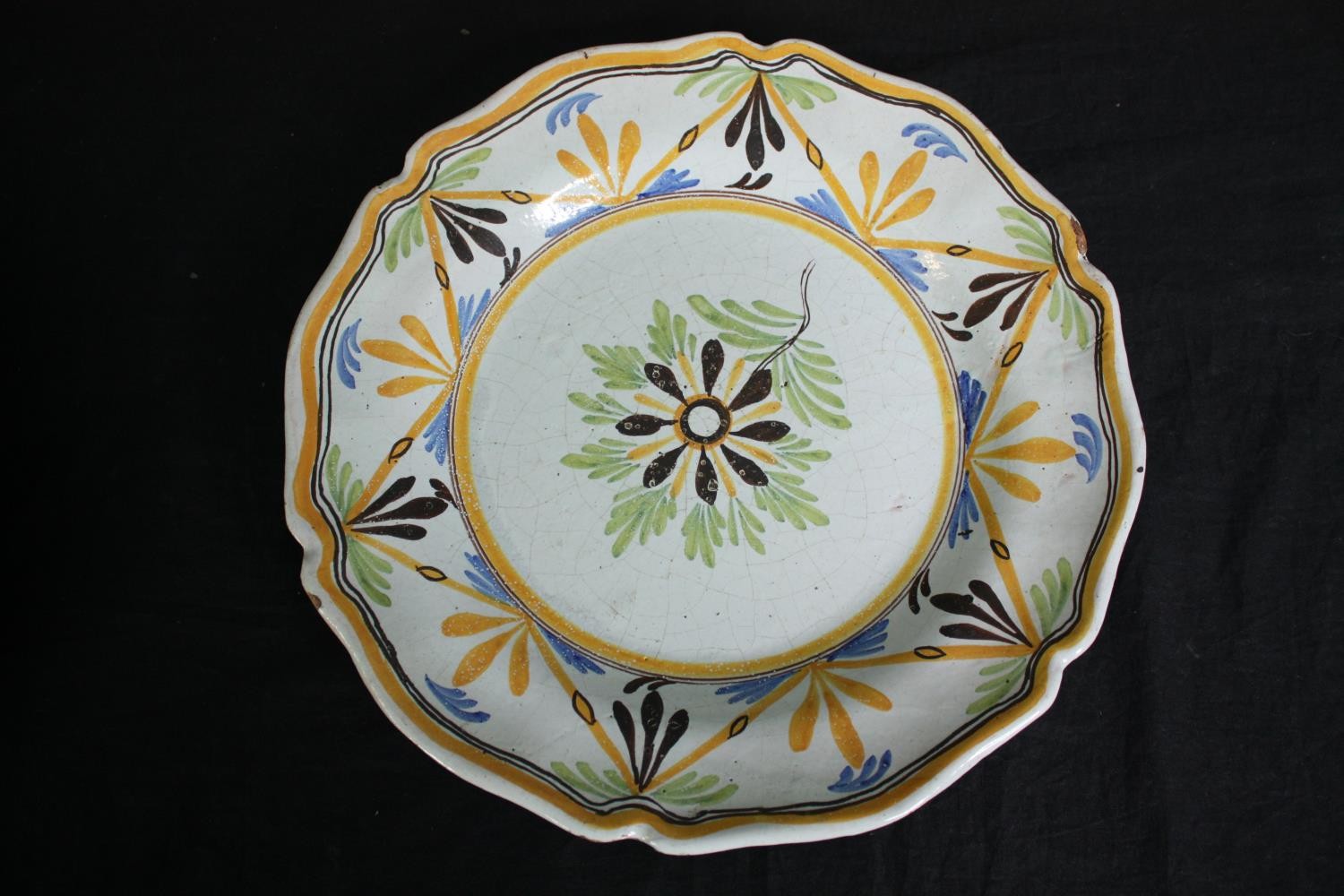A collection of 19th century faience plates. One damaged. Dia.34cm. (largest). - Image 8 of 11
