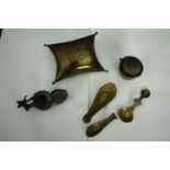 An early 20th century pierced brass cricket cage along with an Indian oil lamp, three spoons and a
