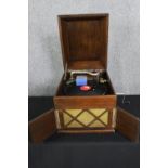 A table top wind up gramaphone by Linguaphone. H.36 W.37 D.46cm.