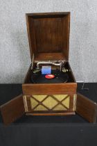 A table top wind up gramaphone by Linguaphone. H.36 W.37 D.46cm.