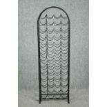 Wine rack, wrought metal floor standing. H.143 W.46 D17cm.