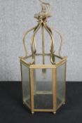 A brass hexagonal hanging lantern. H.55cm.