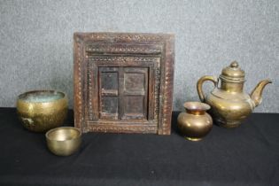 A collection of Eastern brassware and a carved hardwood framed with hinged door. H.40 W.38cm. (