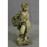 A composite garden statue of a young boy. H.77cm.