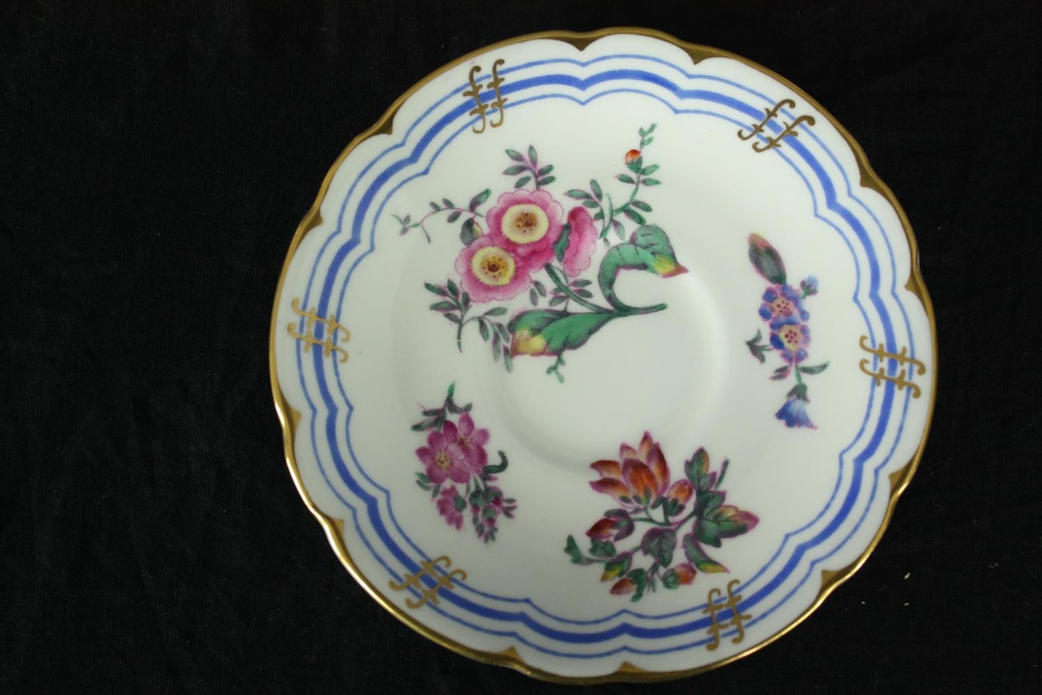 A set of six early 19th century Coalport tea cups and saucers, hand decorated in gilt and with - Image 3 of 7