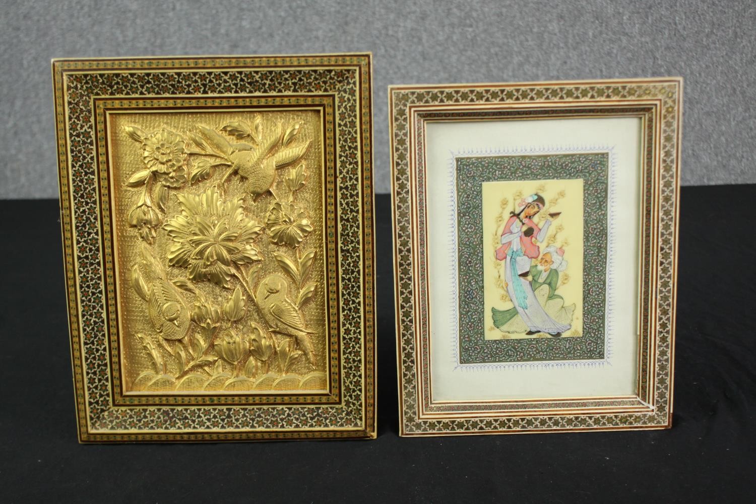 An Indian painting, two figures, and an embossed brass plaque, both in well inlaid bone and hardwood