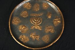 A vintage embossed copper wall hanging plate. Dia.49cm.