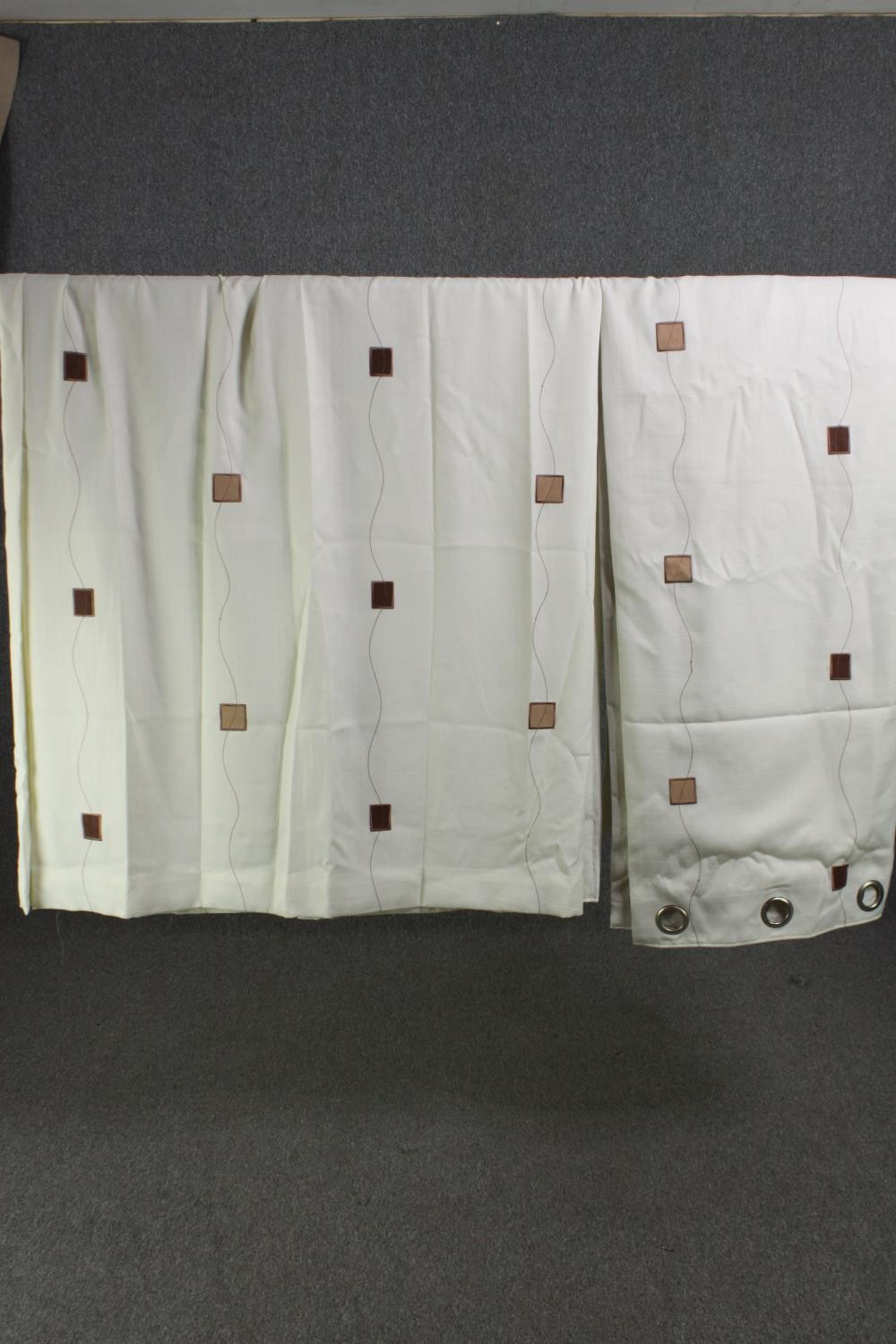 A pair of fully lined white abstract block pattern cotton mix curtains. L.230 W.225cm. (each).