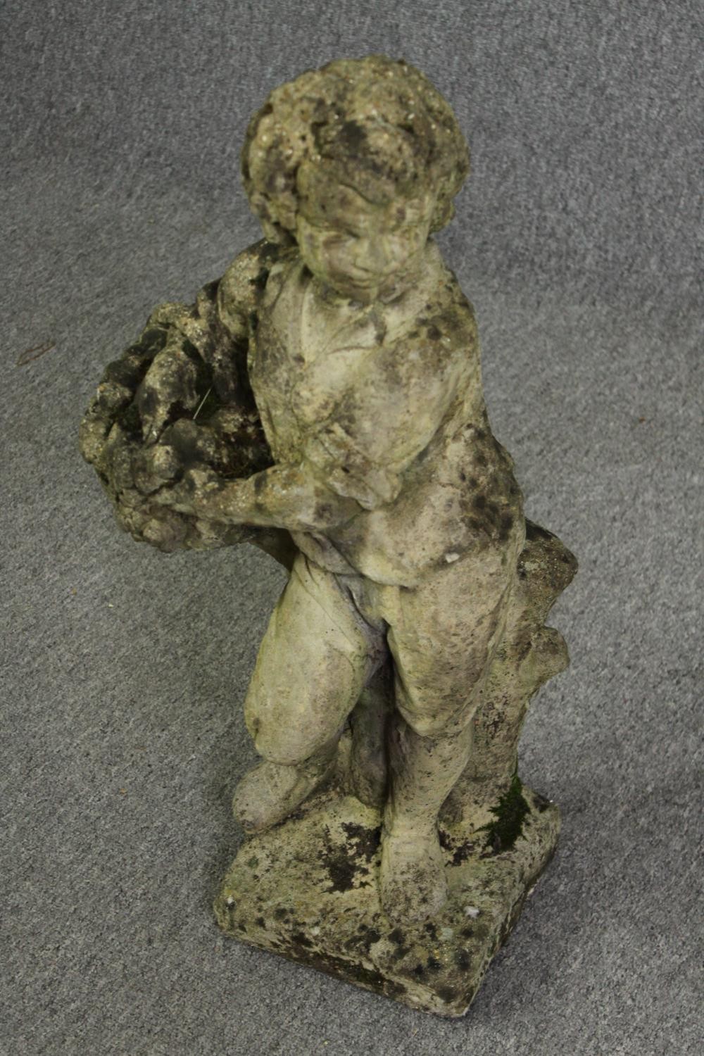 A composite garden statue of a young boy. H.77cm. - Image 3 of 4
