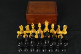A C.1900 Staunton chess set, boxwood and ebony, boxed. H.10 W.21 D.16cm. (box).