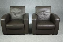 A pair of contemporary leather upholstered armchairs by Bo concept. H.83 W.83 D.80cm. (each).