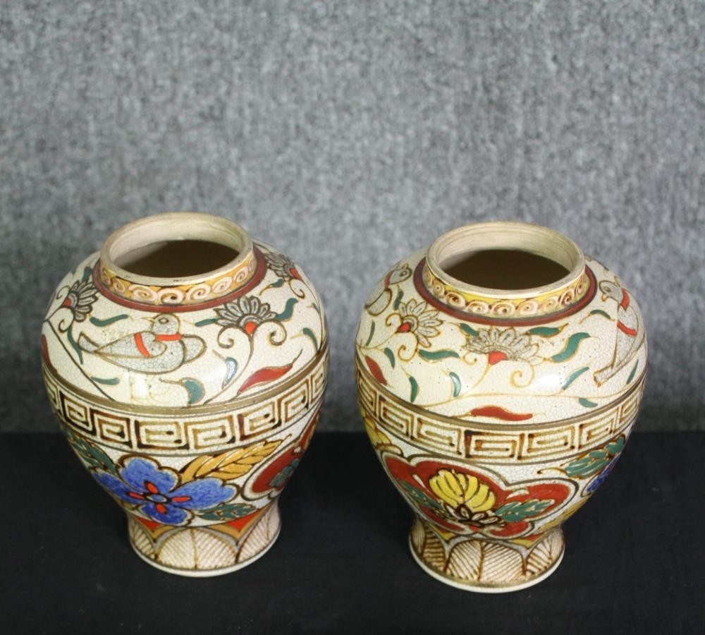 A pair of early 20th century Japanese Satsuma Kinkozan Asano Zo hand painted vases with stylised