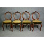 Dining chairs, a set of four Victorian carved walnut.