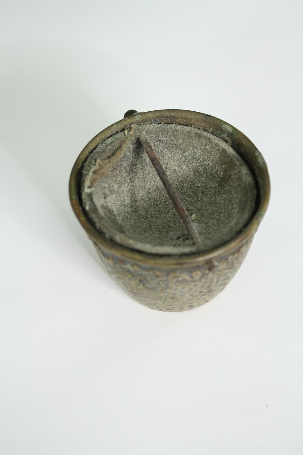 An early 20th century pierced brass cricket cage along with an Indian oil lamp, three spoons and a - Image 8 of 9