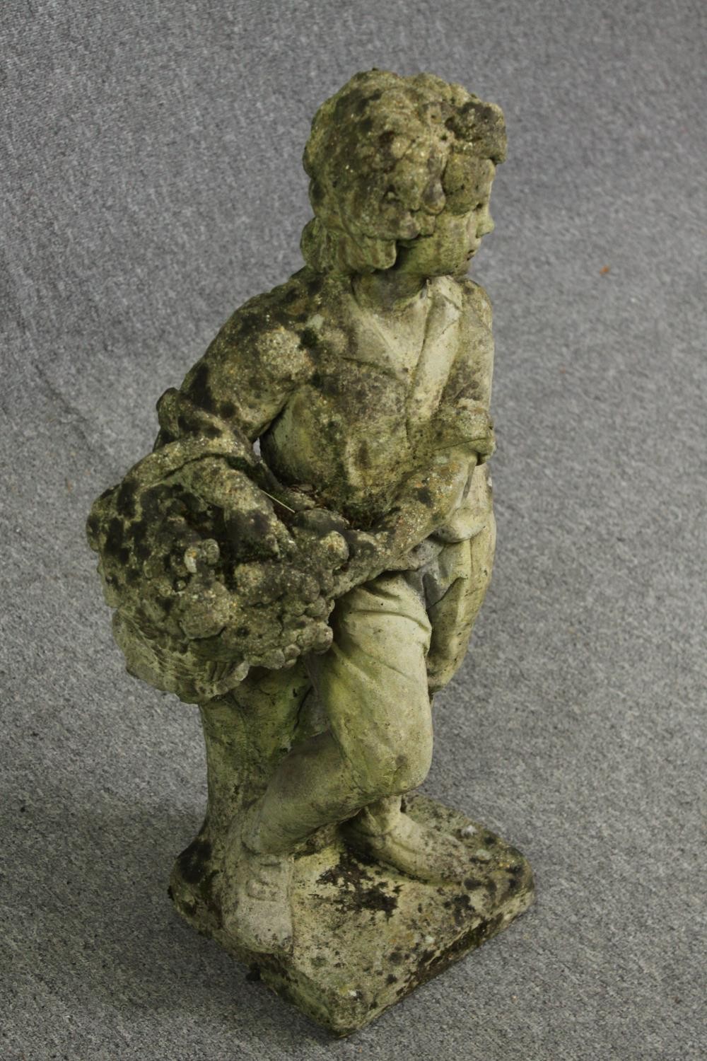 A composite garden statue of a young boy. H.77cm. - Image 2 of 4