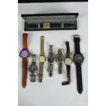 A miscellaneous collection of men's wristwatches. L.25cm. (largest).