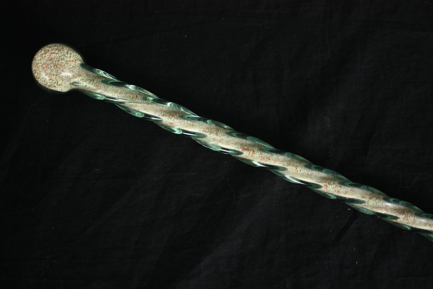 A 19th century spiral twist walking stick, probably Nailsea filled with coloured sugar beads. L. - Image 4 of 4