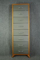 A full height wall cabinet with drop down drawers. H.170 W.52 D.15cm. (One handle needs a repair).