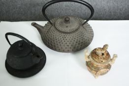 Two Japanese iron tea pots and a Chinese censer (with broken lid). H.23 W.20cm. (largest).