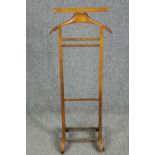 A vintage Italian beech framed clothes valet by Brevettato, stamped with maker's mark. H.110 W.44cm.