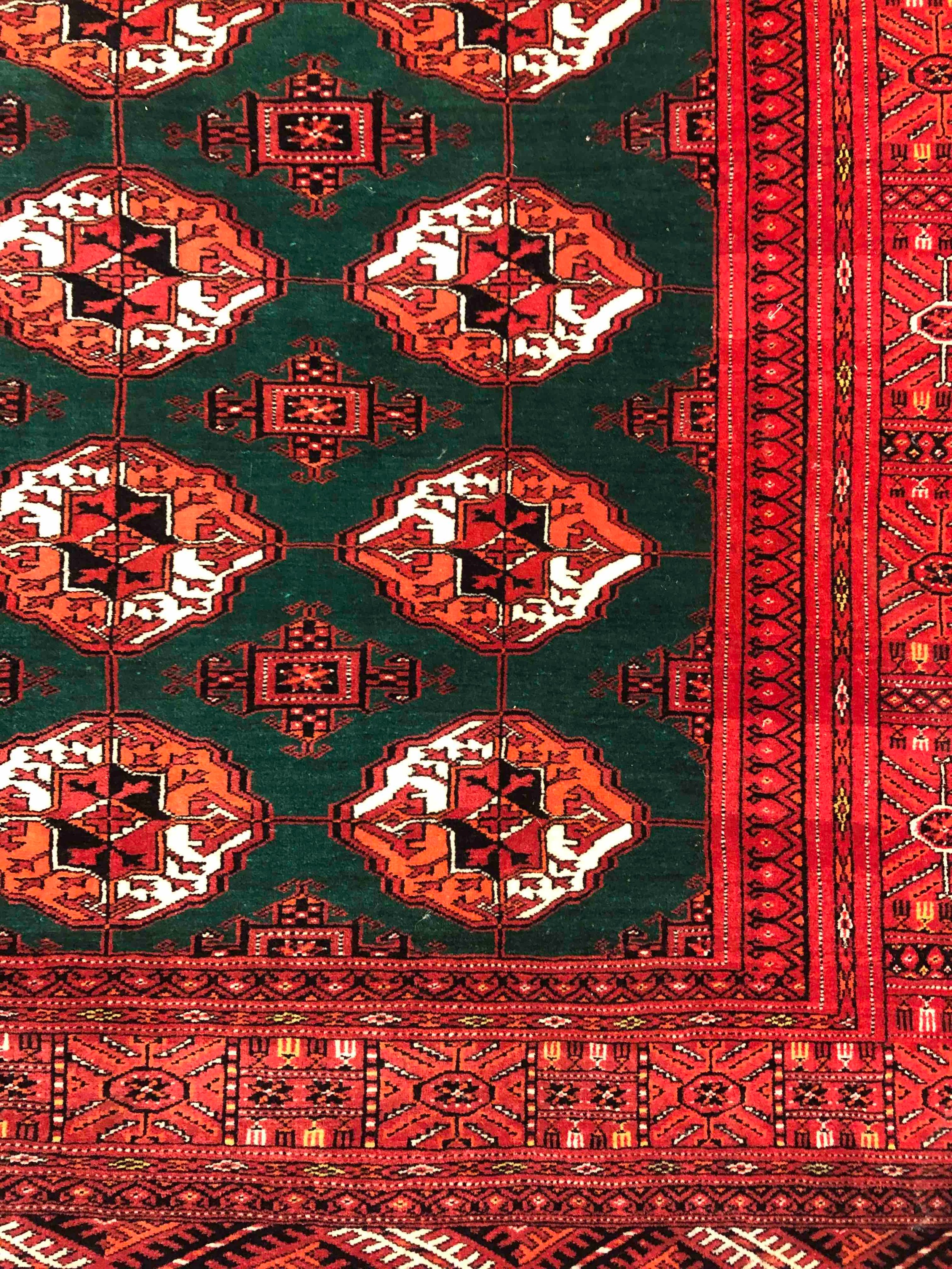 A Bokhara carpet with repeating gul motifs across the field within broad multiple stylised - Image 3 of 4