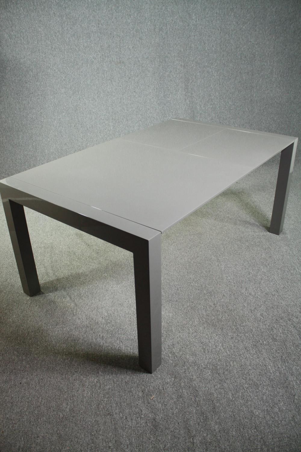 A contemporary extending dining table with integral leaf. H.76 W.170 (ext) D.103cm. - Image 10 of 10