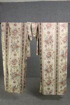A pair of fully lined silk mix curtains with floral design along with tie backs. L.224 W.257cm. (