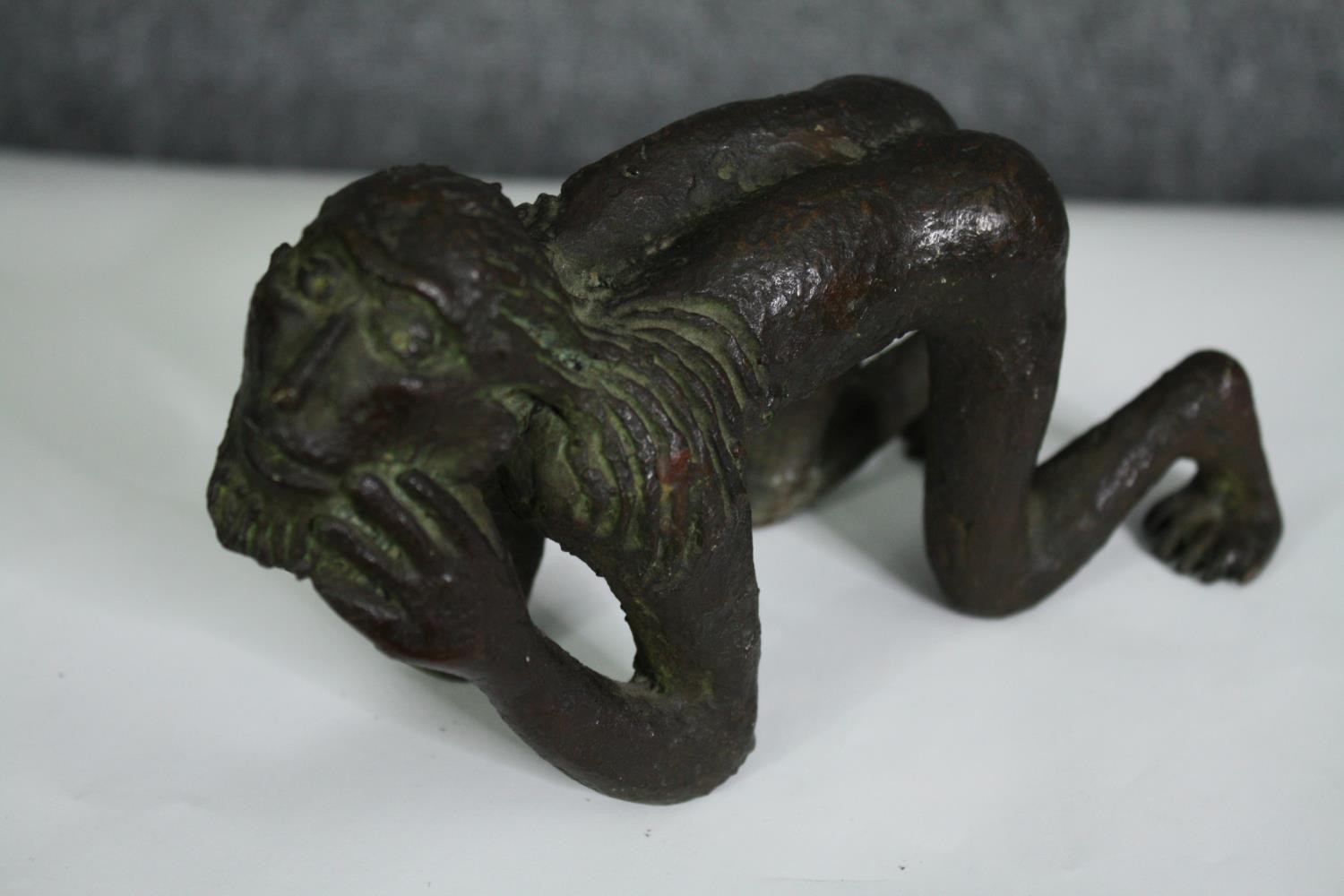 A bronze figure of a crouching man, possibly African. H.10cm. - Image 4 of 6