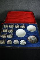 A cased part set of Japanese 19th century egg shell porcelain, including nine coffee cups with