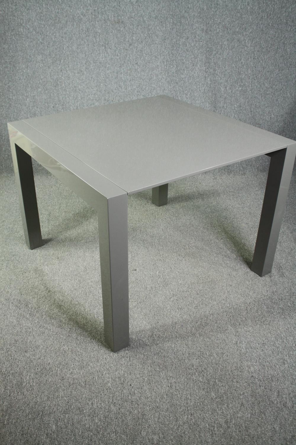 A contemporary extending dining table with integral leaf. H.76 W.170 (ext) D.103cm. - Image 3 of 10