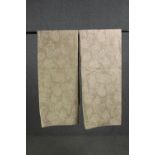 A pair of fully lined beige coloured velour and silk mix curtains with cream scrolling foliate