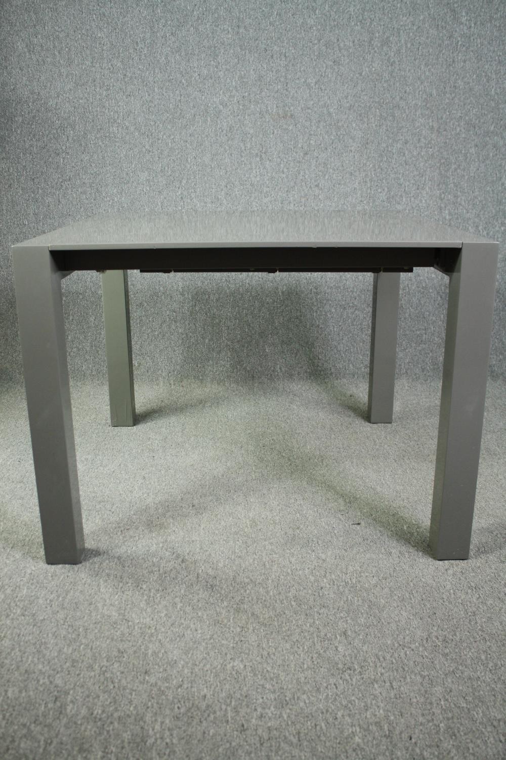 A contemporary extending dining table with integral leaf. H.76 W.170 (ext) D.103cm. - Image 2 of 10